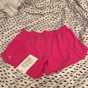 bright pink lululemon shorts.